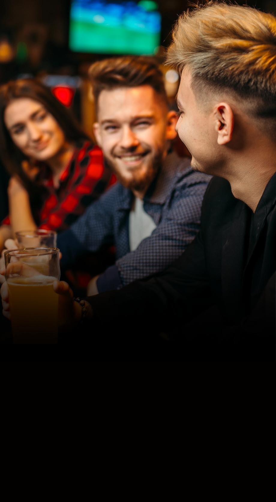 Friends smiling at the bar
